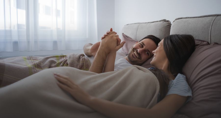 A couple laying in bed